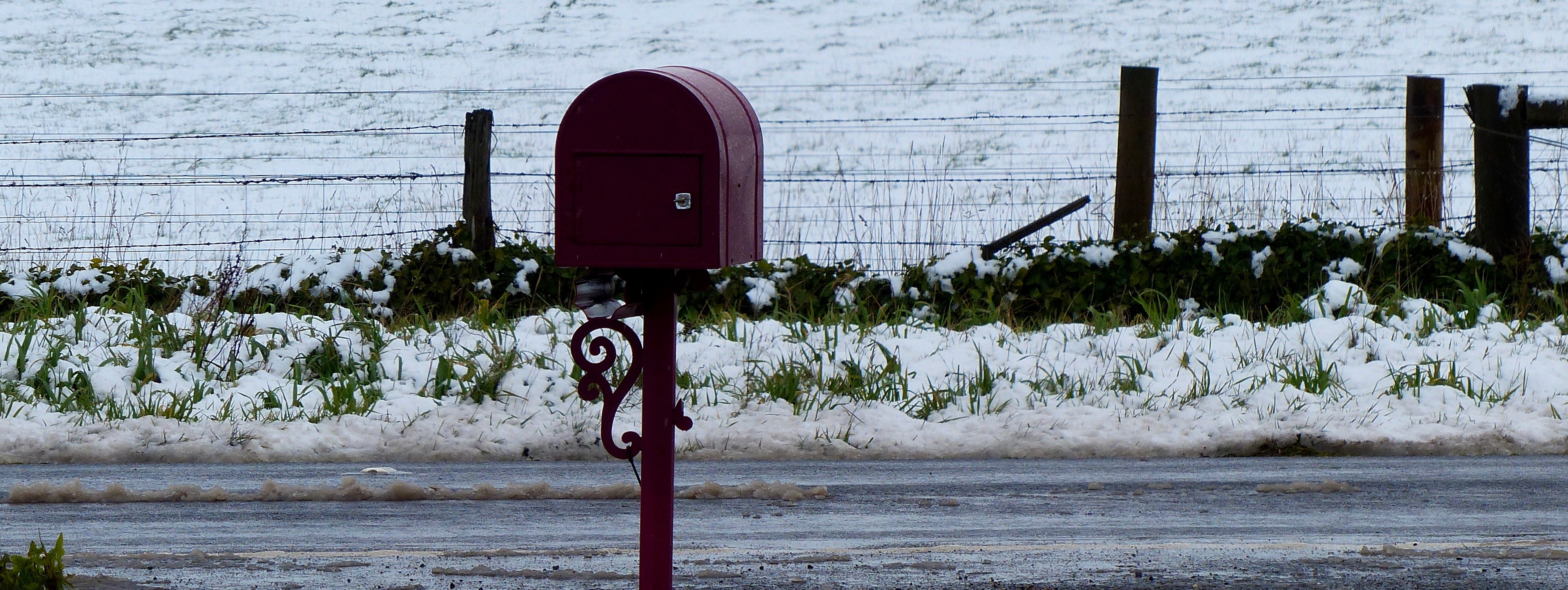 Red mail box in the snow